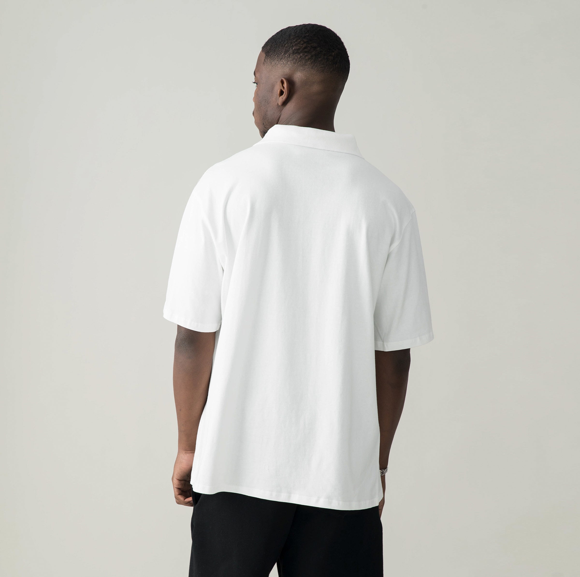 Polo enraciné dans les rituels – Blanc
